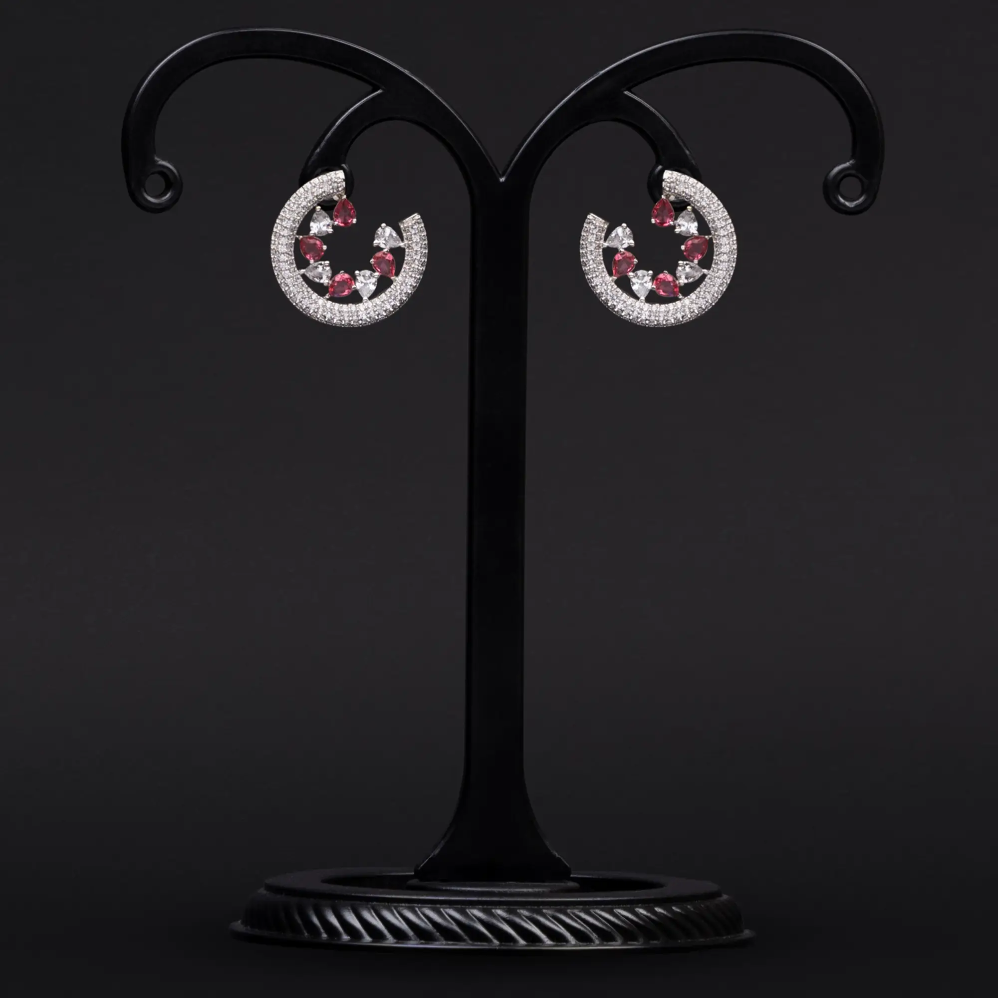 Rhodium Plated Swirl Earrings Adorned with American Diamond with White and Pink Stones
